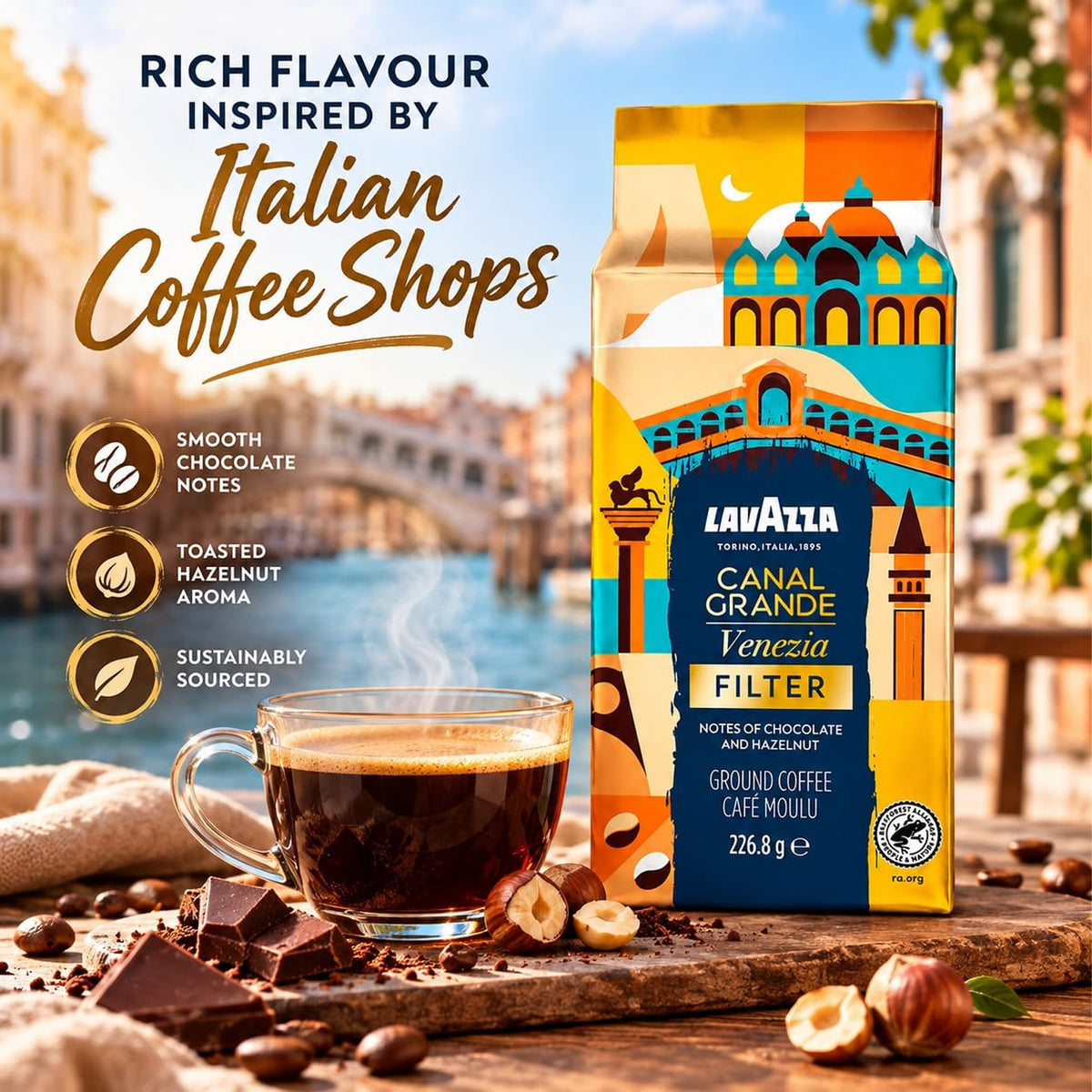 Lavazza Canal Grande Venezia Filter coffee bag displayed next to a steaming cup of espresso on a rustic wooden surface with coffee beans and chocolate pieces, with Italian-themed promotional text in the background.