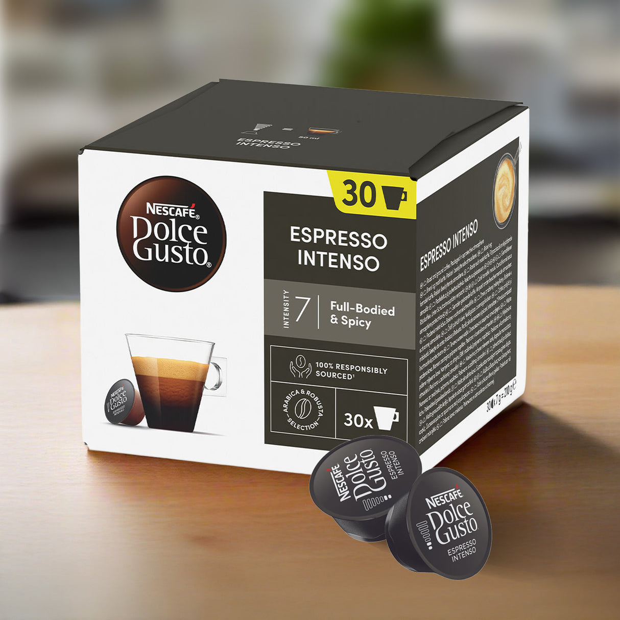 Box of Nescafe Dolce Gusto Espresso Intenso coffee capsules on a wooden surface.