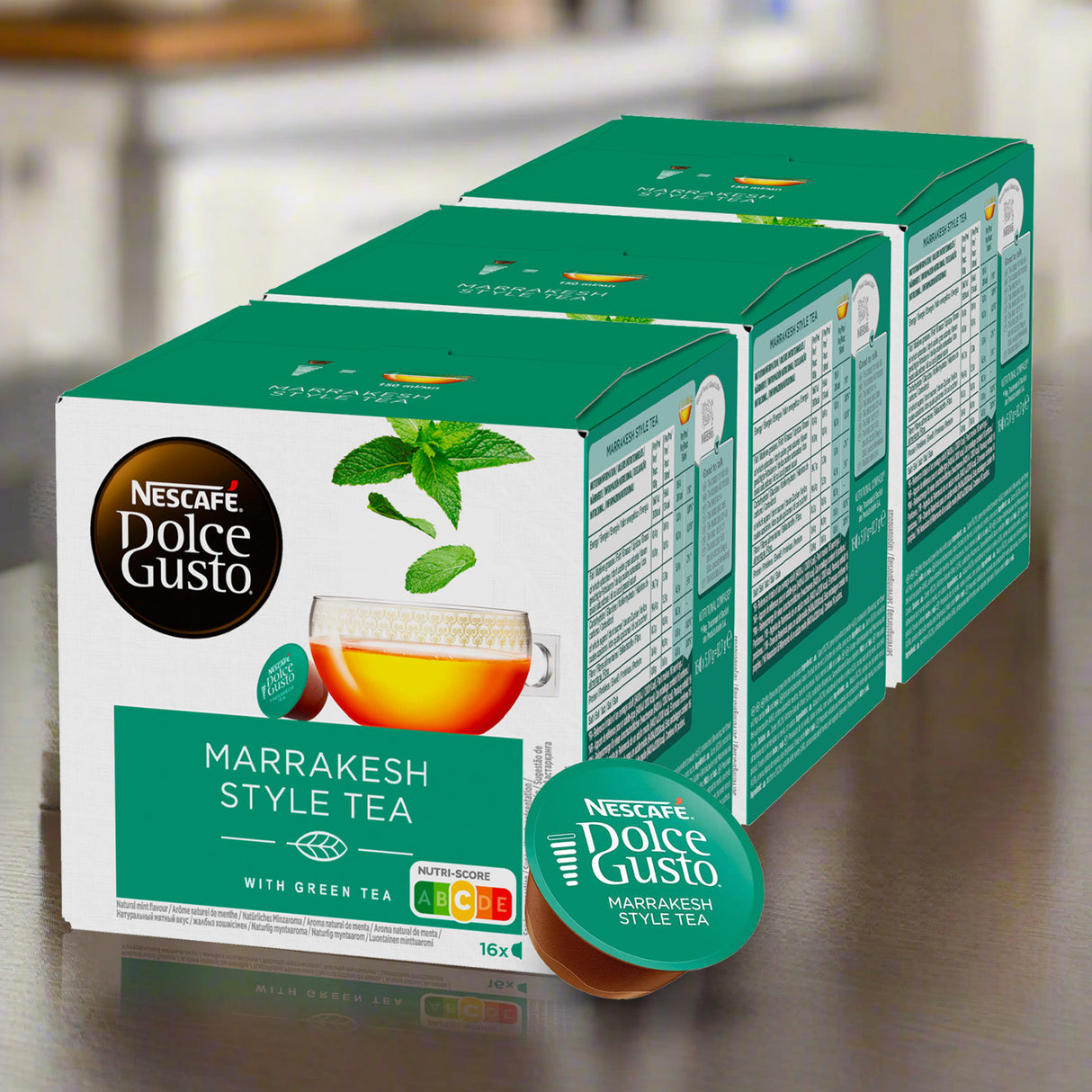 Two boxes of Nescafe Dolce Gusto Marrakesh Style Tea on a reflective surface.