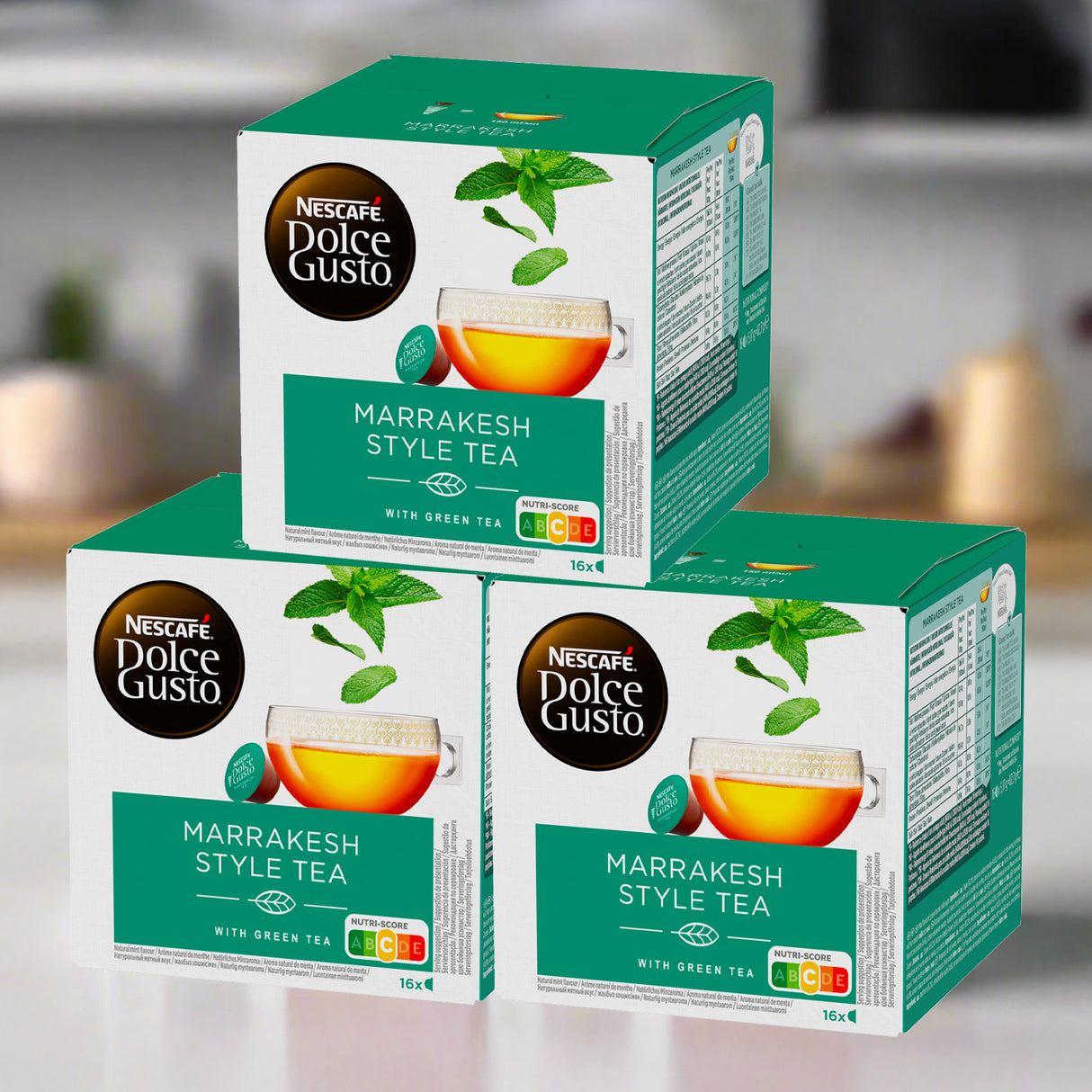 Three boxes of Nescafe Dolce Gusto Marrakesh Style Tea on a blurred kitchen background