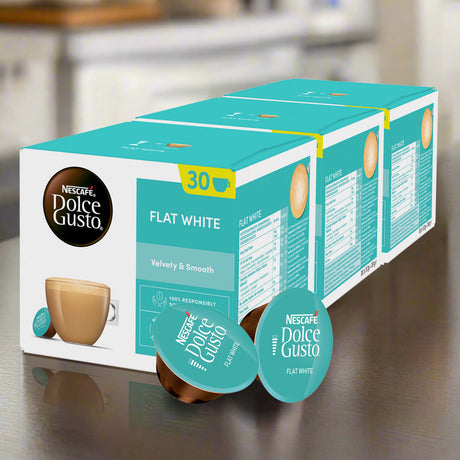 Box of Nestèlé Dolce Gusto Flat White coffee capsules on a kitchen counter.