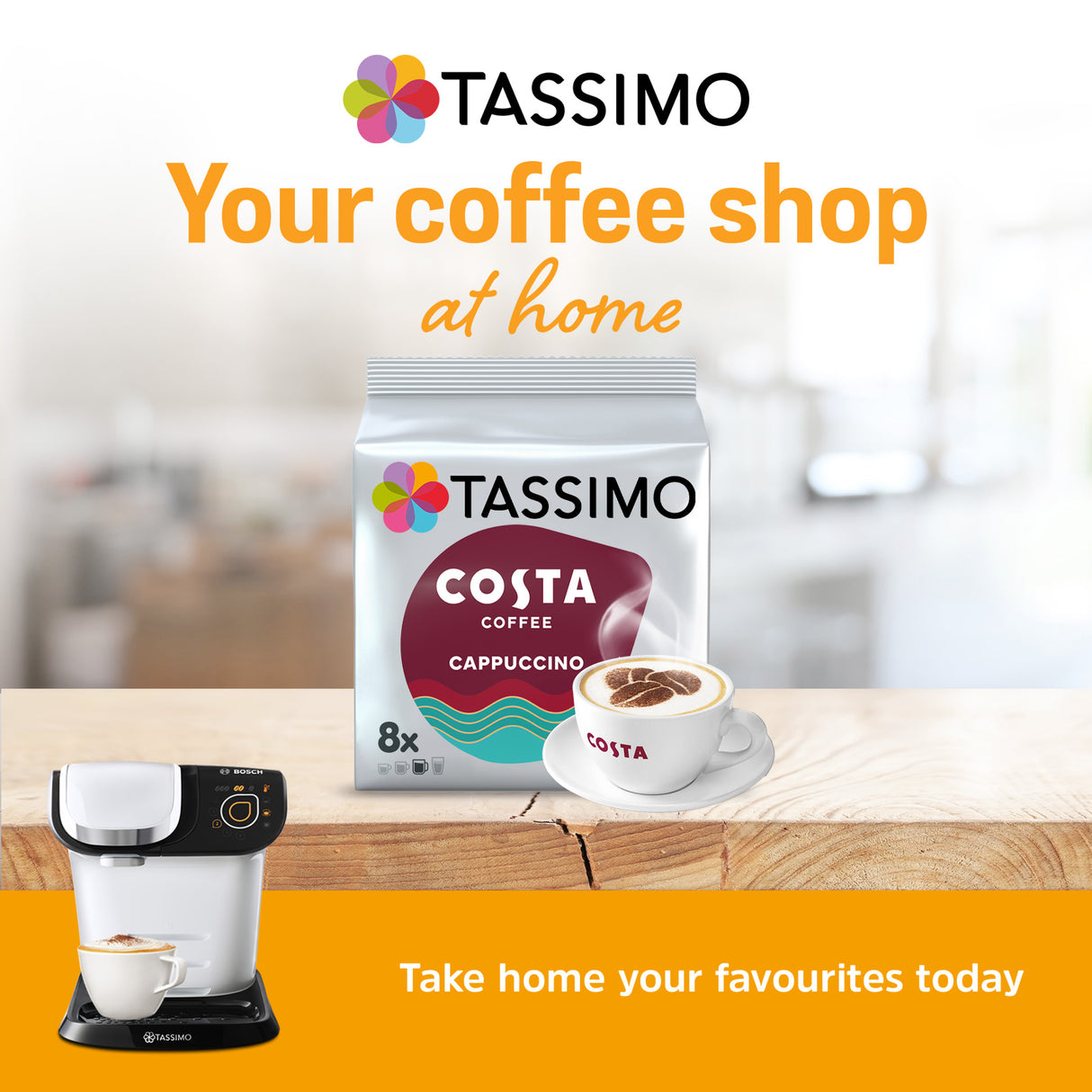 Tassimo coffee pod and machine with 'Your coffee shop at home' text on a blurred kitchen background