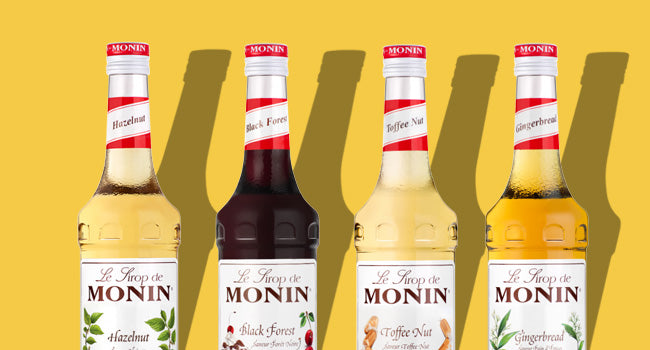 Monin Syrups banner with 4 bottles of Syrup