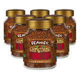 Multiple jars of Beanies Christmas Pudding instant coffee on a white background