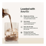 Glass of iced coffee being poured with health benefits text on a light background