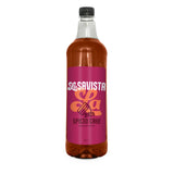 A 1L clear bottle of Savista Spiced Cake Flavour Syrup filled with amber-brown liquid, featuring a bright magenta label with white and orange branding, on a plain white background.