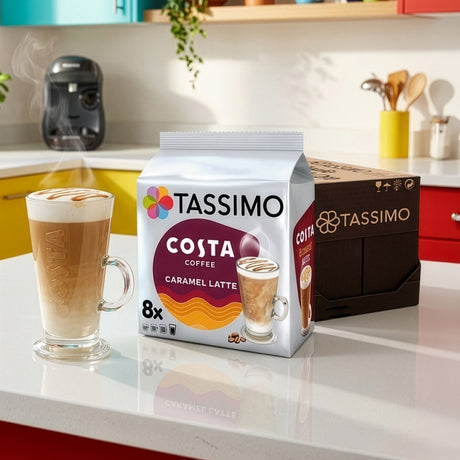 Tassimo Costa Coffee package and a steaming cup of coffee on a kitchen counter.