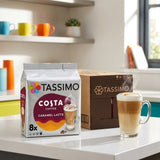 Tassimo Costa Coffee Caramel Latte packaging with a cup of coffee on a kitchen counter.