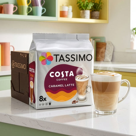 Tassimo Costa Coffee package with a glass of Caramel Latte on a kitchen counter.