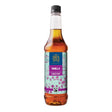 Bottle of Tate & Lyle vanilla syrup on a white background