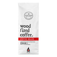 A white bag of Northern Beaches Wood Fired Coffee Beans on a plain white background, featuring black text and a red horizontal band.