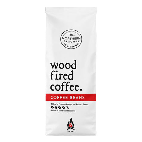 A white bag of Northern Beaches Wood Fired Coffee Beans on a plain white background, featuring black text and a red horizontal band.