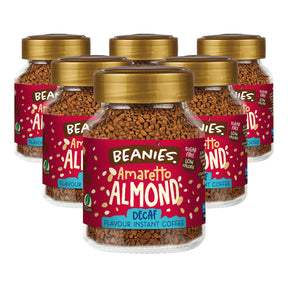 Six jars of Beanies Amaretto Almond Decaf instant coffee on a white background
