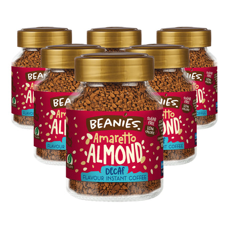 Six jars of Beanies Amaretto Almond Decaf instant coffee on a white background