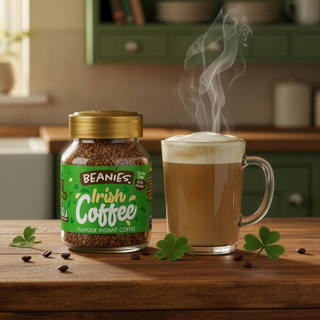 Beanies Irish Coffee jar with a steaming cup of coffee on a wooden surface.
