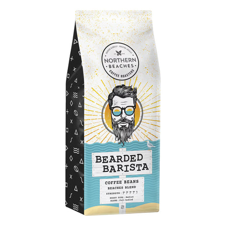 A bag of Northern Beaches Coffee Roasters 'Bearded Barista' coffee beans, featuring a white and black illustrated package with a cartoon bearded man wearing glasses and a gold sunburst design.