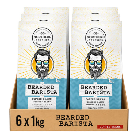 A retail display box containing six bags of Northern Beaches Bearded Barista coffee beans, each bag featuring a white and blue design with a stylized illustration of a bearded man wearing sunglasses.