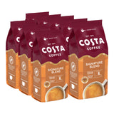 Multiple bags of Costa Coffee Signature Blend on a white background