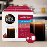 Nescafe Dolce Gusto Americano Decaffeinato coffee pod box with a glass of coffee.