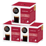 Three boxes of Dolce Gusto Americano coffee capsules on a white background