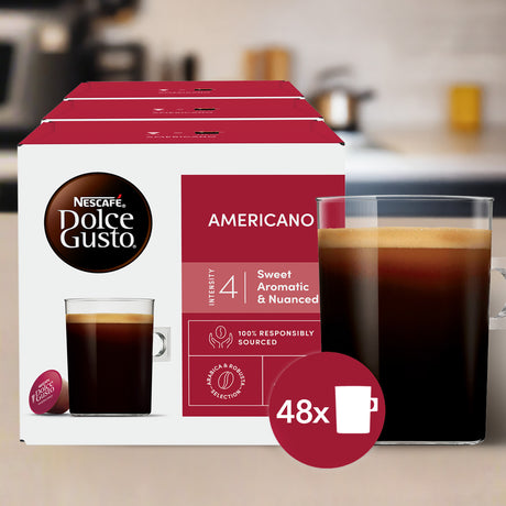 Nescafe Dolce Gusto Americano coffee pod box with a glass of coffee in a kitchen setting