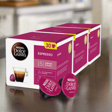 Nescafe Dolce Gusto Espresso coffee capsule boxes on a reflective surface