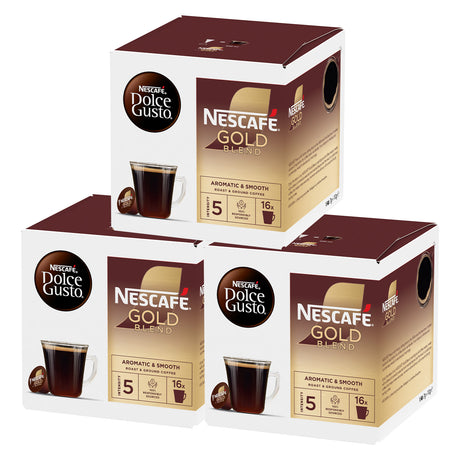 Three boxes of Nescafe Gold Blend and Dolce Gusto coffee capsules on a white background