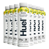 Multiple bottles of Hue nutritional meal replacement with banana flavor on a white background