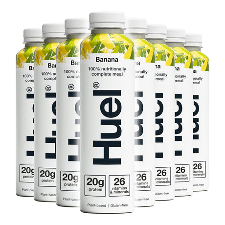 Multiple bottles of Hue nutritional meal replacement with banana flavor on a white background