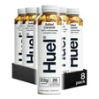 Huel salted caramel meal replacement shake containers on a white background