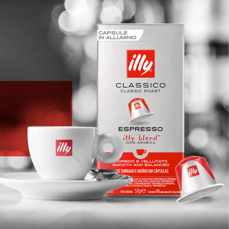 Illy coffee capsule packaging with a cup and saucer in the foreground