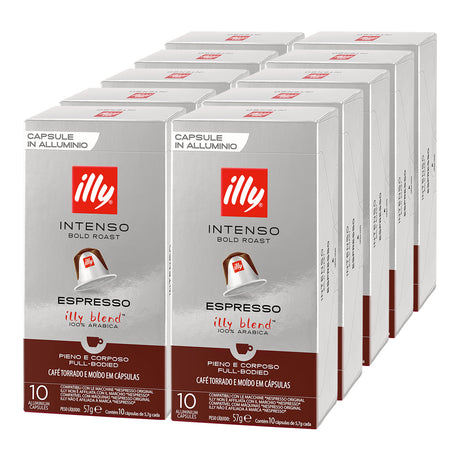 Multiple boxes of illy Intenso Bold Roast Espresso capsules on a white background