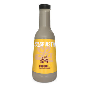 A bottle of LaSavista Banoffee Flavoured Sauce on a plain white background. The bottle is filled with a light brown sauce and features a bright yellow label with white and brown text, topped with a black cap.