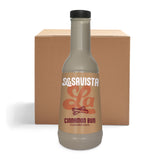 A bottle of LaSavista Cinnamon Bun Flavoured Sauce stands in front of a plain brown cardboard box on a white background.