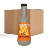A bottle of La Savista Salted Caramel Flavoured Sauce in the foreground, with a large brown cardboard shipping box behind it on a white background.
