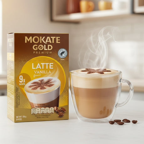 Mokate Gold Premium Latte Vanilla coffee packaging with a steaming cup of coffee in the background.