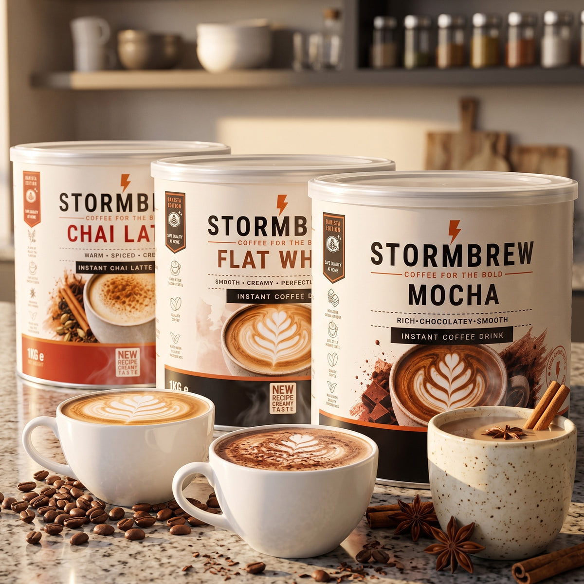 Three Stormbrew instant coffee cans labelled Chai Latte, Flat White, and Mocha, displayed on a counter-top with matching coffee cups, coffee beans, and spices in a kitchen setting.