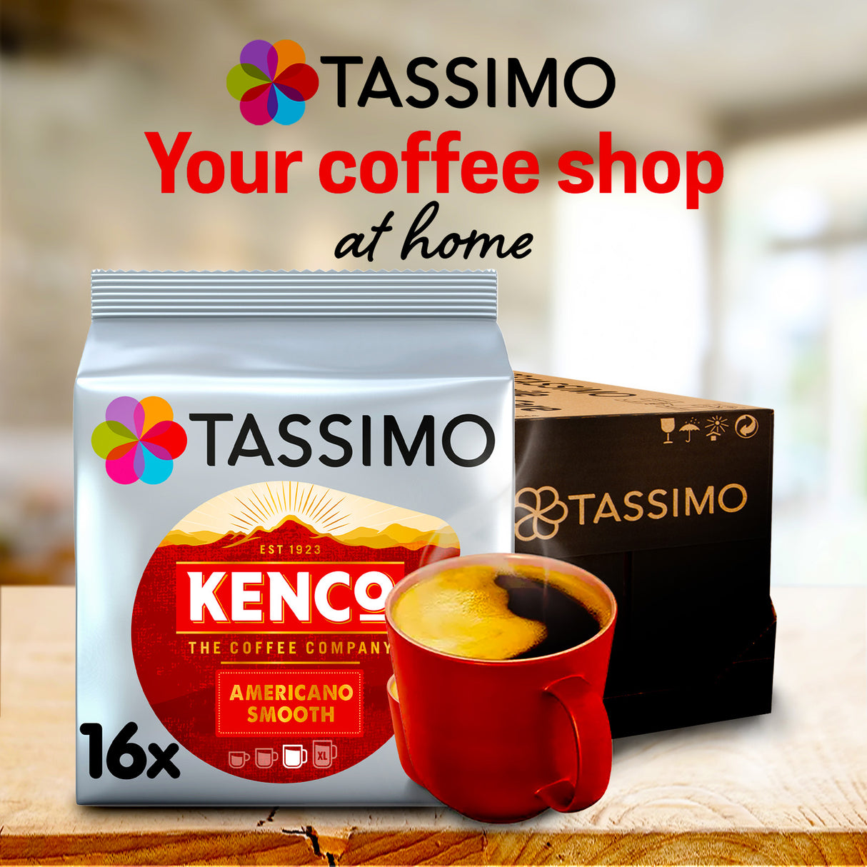 Tassimo Kenco coffee packaging with a red cup of coffee on a wooden surface.
