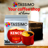 Tassimo Kenco coffee packaging with a red cup of coffee on a wooden surface.