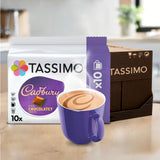 Tassimo Cadbury chocolate coffee pods with a purple mug on a kitchen counter.