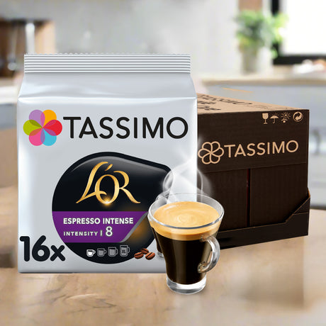 Tassimo L'OR Espresso Intense packaging with a steaming cup of coffee on a kitchen counter.