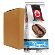 A 1000g bag of Napoli espresso coffee stands in front of a plain brown cardboard shipping box on a white background. The bag is white with a prominent red and black Napoli logo, a photo of roasted coffee beans, and blue brand lettering near the bottom.